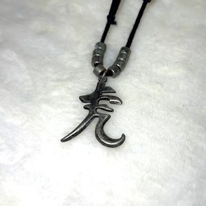 Asian symbol pendant on leather cord
